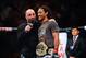 August 11, 2012; Denver, CO, USA; UFC host Joe Rogan (left) talks with Benson Henderson (right) after he defeated Frankie Edgar (not pictured) during UFC 150 at the Pepsi Center. Mandatory Credit: Ron Chenoy-USA TODAY Sports