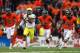 CORVALLIS, OR - NOVEMBER 24: Kenjon Barner #24 of the Oregon Ducks out runs the defense of the Oregon State Beavers during the 116th Civil War on November 24, 2012 at the Reser Stadium in Corvallis, Oregon. (Photo by Jonathan Ferrey/Getty Images)