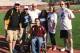Chris Canales and members of his Gridiron Heroes support group pose with Texas State head coach Dennis Franchione (white shirt center).