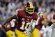 LANDOVER, MD - DECEMBER 03: Robert Griffin III #10 of the Washington Redskins scrambles with the ball in the second half against the New York Giants at FedExField on December 3, 2012 in Landover, Maryland. (Photo by Patrick McDermott/Getty Images)