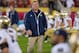 Nov. 24, 2012; Los Angeles, CA, USA; Notre Dame Fighting Irish head coach Brian Kelly walks on the field during warm ups before the game against the USC Trojans at the Los Angeles Memorial Coliseum. Notre Dame won 22-13. Mandatory Credit: Matt Cashore-USA TODAY Sports