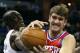 CHARLOTTE, NC - NOVEMBER 30: Spencer Hawes #00 of the Philadelphia 76ers battles for a loose ball with Bismack Biyombo #0 of the Charlotte Bobcats during their game at Time Warner Cable Arena on November 30, 2012 in Charlotte, North Carolina. NOTE TO USER: User expressly acknowledges and agrees that, by downloading and or using this photograph, User is consenting to the terms and conditions of the Getty Images License Agreement. (Photo by Streeter Lecka/Getty Images)