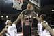 Dec 5, 2012; Sacramento, CA, USA; Toronto Raptors power forward Ed Davis (32) shoots the ball between Sacramento Kings power forward James Johnson (52) and power forward Thomas Robinson (0) during the second quarter at Sleep Train Arena. Mandatory Credit: Kelley L Cox-USA TODAY Sports