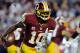 LANDOVER, MD - DECEMBER 03: Robert Griffin III #10 of the Washington Redskins scrambles with the ball in the second half against the New York Giants at FedExField on December 3, 2012 in Landover, Maryland. (Photo by Patrick McDermott/Getty Images)