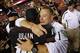 LANDOVER, MD - SEPTEMBER 29: Head coach Butch Jones of the Cincinnati Bearcats hugs receiver Damon Julia #16 after his team defeated the Virginia Tech Hokies 27-24 at FedExField on September 29, 2012 in Landover, Maryland. (Photo by Jonathan Ernst/Getty Images)