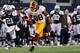 ARLINGTON, TX - NOVEMBER 22: Pierre Garcon #88 of the Washington Redskins carries the ball to score a touchdown against Mike Jenkins #21 of the Dallas Cowboys on Thanksgiving Day at Cowboys Stadium on November 22, 2012 in Arlington, Texas. (Photo by Tom Pennington/Getty Images)