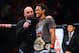 August 11, 2012; Denver, CO, USA; UFC host Joe Rogan (left) talks with Benson Henderson (right) after he defeated Frankie Edgar (not pictured) during UFC 150 at the Pepsi Center. Mandatory Credit: Ron Chenoy-USA TODAY Sports
