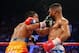 LAS VEGAS, NV - DECEMBER 08: (L-R) Michael Farenas throws a right at Yuriorkis Gamboa during their super featherweight bout at the MGM Grand Garden Arena on December 8, 2012 in Las Vegas, Nevada. (Photo by Al Bello/Getty Images)