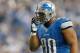 DETROIT, MI - NOVEMBER 22: Ndamukong Suh #90 of the Detroit Lions adjusts his face mask while playing the Houston Texans at Ford Field on November 22, 2012 in Detroit, Michigan. Houston won the game 34-31. (Photo by Gregory Shamus/Getty Images)