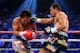 LAS VEGAS, NV - DECEMBER 08: (R-L) Juan Manuel Marquez lands a right to the face of Manny Pacquiao during their welterweight bout at the MGM Grand Garden Arena on December 8, 2012 in Las Vegas, Nevada. (Photo by Al Bello/Getty Images)
