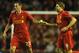 LIVERPOOL, ENGLAND - NOVEMBER 22: Steven Gerrard of Liverpool takes the captain's armband from team-mate Jamie Carragher (L) after coming on as a substitute during the UEFA Europa League Group A match between Liverpool FC and BSC Young Boys at Anfield on November 22, 2012 in Liverpool, England. (Photo by Chris Brunskill/Getty Images)
