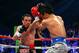 LAS VEGAS, NV - DECEMBER 08: (L-R) Juan Manuel Marquez throws a left at Manny Pacquiao during their welterweight bout at the MGM Grand Garden Arena on December 8, 2012 in Las Vegas, Nevada. (Photo by Al Bello/Getty Images)
