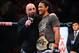 August 11, 2012; Denver, CO, USA; UFC host Joe Rogan (left) talks with Benson Henderson (right) after he defeated Frankie Edgar (not pictured) during UFC 150 at the Pepsi Center. Mandatory Credit: Ron Chenoy-USA TODAY Sports
