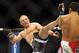 Dec 8, 2012, Seattle, WA, USA; Dennis Siver, left, kicks Nam Phan during the first round of their featherweight bout at MMA on FOX 5 at Key Arena. Mandatory Credit: Joe Nicholson-USA TODAY Sports
