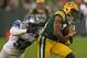 GREEN BAY, WI - DECEMBER 09: Randall Cobb #18 of the Green Bay Packers breaks away from Justin Durant #52 of the Detroit Lions after a catch at Lambeau Field on December 9, 2012 in Green Bay, Wisconsin. The Packers defeated the Lions 27-20. (Photo by Jonathan Daniel/Getty Images)