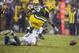 GREEN BAY, WI - DECEMBER 9: Matthew Stafford #9 of the Detroit Lions can not get a hold on the ball he fumbled as Mike Daniels #76 of the Green Bay Packers scoops it up at Lambeau Field on December 9, 2012 in Green Bay, Wisconsin. (Photo by Tom Lynn/Getty Images)
