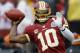 LANDOVER, MD - DECEMBER 09: Quarterback Robert Griffin III #10 of the Washington Redskins throws a pass while warming up before the start of the Redskins and Baltimore Ravens game at FedExField on December 9, 2012 in Landover, Maryland. (Photo by Rob Carr/Getty Images)