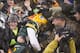 GREEN BAY, WI - DECEMBER 9: Aaron Rodger #12 of the Green Bay Packers runs for a touchdown against the Detroit Lions and then does a Lambeau leap at Lambeau Field on December 9, 2012 in Green Bay, Wisconsin. (Photo by Tom Lynn /Getty Images)