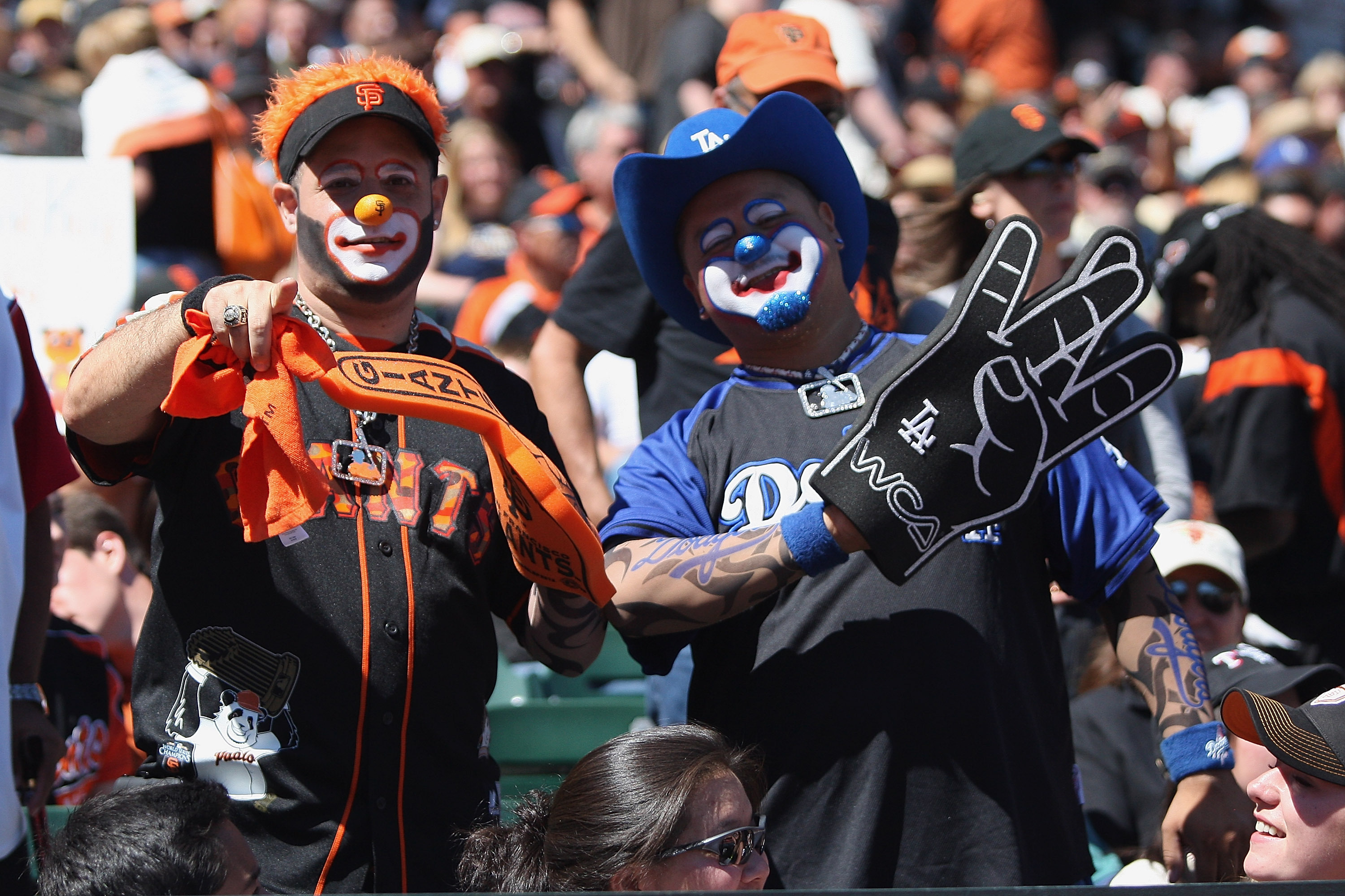 SAN FRANCISCO, CA - SEPTEMBER 08: A San Francisco Giants and a Los Angeles Dodgers fan dress as clowns at AT&T Park on September 8, 2012 in San Francisco, California. (Photo by Tony Medina/Getty Images)