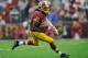 LANDOVER, MD - DECEMBER 09: Robert Griffin III #10 of the Washington Redskins scrambles with the ball against the Baltimore Ravens in the second half during a game at FedExField on December 9, 2012 in Landover, Maryland. (Photo by Patrick McDermott/Getty Images)