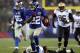 EAST RUTHERFORD, NJ - DECEMBER 09: David Wilson #22 of the New York Giants carries the ball past Isa Abdul-Quddus #42 of the New Orleans Saints to score his third touchdown of the game on December 9, 2012 at MetLife Stadium in East Rutherford, New Jersey. (Photo by Elsa/Getty Images)