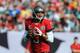 TAMPA, FL - DECEMBER 9: Quarterback Josh Freeman #5 of the Tampa Bay Buccaneers sets to pass against the Philadelphia Eagles December 9, 2012 at Raymond James Stadium in Tampa, Florida. The Eagles won 23 - 21. (Photo by Al Messerschmidt/Getty Images)