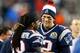 FOXBORO, MA - DECEMBER 10: Tom Brady #12 of the New England Patriots smiles with teammate Donte' Stallworth #19 from the sideline in the fourth quarter against the Houston Texans at Gillette Stadium on December 10, 2012 in Foxboro, Massachusetts. (Photo by Jim Rogash/Getty Images)