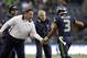 Dec 9, 2012, Seattle, WA, USA; Seattle Seahawks head coach Pete Carroll (center right) greets Seattle Seahawks quarterback Russell Wilson (3) following a touchdown pass against the Arizona Cardinals during the second quarter at CenturyLink Field. Mandatory Credit: Joe Nicholson-USA TODAY Sports