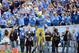 PASADENA, CA - NOVEMBER 17: Johnathan Franklin #23 of the UCLA Bruins celebrates his touchdown with fans as he is lifted by Joseph Fauria #8 during a 38-28 win over the USC Trojans at Rose Bowl on November 17, 2012 in Pasadena, California. (Photo by Harry How/Getty Images)