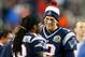 FOXBORO, MA - DECEMBER 10: Tom Brady #12 of the New England Patriots smiles with teammate Donte' Stallworth #19 from the sideline in the fourth quarter against the Houston Texans at Gillette Stadium on December 10, 2012 in Foxboro, Massachusetts. (Photo by Jim Rogash/Getty Images)