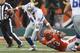 CINCINNATI, OH - DECEMBER 09: Michael Johnson #93 of the Cincinnati Bengals sacks Tony Romo #9 of the Dallas Cowboys during their game at Paul Brown Stadium on December 9, 2012 in Cincinnati, Ohio. The Cowboys defeated the Bengals 20-19. (Photo by John Grieshop/Getty Images)