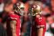 SAN FRANCISCO, CA - DECEMBER 09: Quarterbacks Colin Kaepernick #7 and Alex Smith #11 of the San Francisco 49ers take warm ups before their game against the Miami Dolphins at Candlestick Park on December 9, 2012 in San Francisco, California. (Photo by Ezra Shaw/Getty Images)