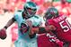 TAMPA, FL - DECEMBER 9: Quarterback Nick Foles #9 of the Philadelphia Eagles runs away from linebacker Daniel Te'o-Nesheim #50 of the Tampa Bay Buccaneers December 9, 2012 at Raymond James Stadium in Tampa, Florida. The Eagles won 23 - 21. (Photo by Al Messerschmidt/Getty Images)