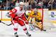 NASHVILLE, TN - MARCH 10: Darren Helm #43 of the Detroit Red Wings skates against Pekka Rinne #35 of the Nashville Predators at Bridgestone Arena on March 10, 2012 in Nashville, Tennessee. (Photo by Frederick Breedon/Getty Images)
