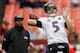 LANDOVER, MD - DECEMBER 09: Quarterback Joe Flacco #5 of the Baltimore Ravens warms up as quarterbacks coach Jim Caldwell looks on prior to the start of the Ravens game against the Washington Redskins at FedExField on December 9, 2012 in Landover, Maryland. (Photo by Rob Carr/Getty Images)