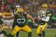 GREEN BAY, WI - DECEMBER 09: Aaron Rodgers #12 of the Green Bay Packers takes the snap from Jeff Saturday #63 against the Detroit Lions at Lambeau Field on December 9, 2012 in Green Bay, Wisconsin. The Packers defeated the Lions 27-20. (Photo by Jonathan Daniel/Getty Images)