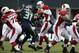 Arizona quarterbacks felt the heat in Sunday's 58-0 whitewash.