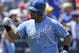 KANSAS CITY, MO - JUNE 24: Brayan Pena #27 of the Kansas City Royals pumps his fist as he scores on a Jarrod Dyson triple during an interleague game against the St. Louis Cardinals at Kauffman Stadium on June 24, 2012 in Kansas City, Missouri. (Photo by Ed Zurga/Getty Images)