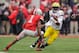 COLUMBUS, OH - NOVEMBER 24: Quarterback Denard Robinson #16 of the Michigan Wolverines runs with the ball against the Ohio State Buckeyes at Ohio Stadium on November 24, 2012 in Columbus, Ohio. (Photo by Jamie Sabau/Getty Images)