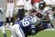 HOUSTON, TX - SEPTEMBER 11: Wide receiver Andre Johnson #80 of the Houston Texans is tackled by linebacker Gary Brackett #58 of the Indianapolis Colts on September 11, 2011 at Reliant Stadium in Houston, Texas. Texans won 34 to 7.(Photo by Thomas B. Shea/Getty Images)