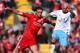 LIVERPOOL, ENGLAND - APRIL 07: Andy Carroll of Liverpool is tackled by Stephen Ireland of Aston Villa during the Barclays Premier League match between Liverpool and Aston Villa at Anfield on April 7, 2012 in Liverpool, England. (Photo by Alex Livesey/Getty Images)