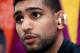 BOLTON, ENGLAND - JULY 18: Boxer Amir Khan speaks to the media during the Amir Khan & USA Olympic Boxing Team Press Day at the Gloves Community Gym on July 18, 2012 in Bolton, England (Photo by Paul Thomas/Getty Images)