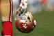 SAN FRANCISCO, CA - DECEMBER 09: A San Francisco 49ers player carries his helmet before their game against the Miami Dolphins at Candlestick Park on December 9, 2012 in San Francisco, California. (Photo by Ezra Shaw/Getty Images)