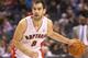 Nov 12, 2012; Toronto, ON, Canada; Toronto Raptors guard Jose Calderon (8) dribbles against the Utah Jazz at the Air Canada Centre. The Jazz beat the Raptors 140-133 in triple overtime. Mandatory Credit: Tom Szczerbowski-USA TODAY Sports
