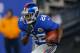 Dec 9, 2012; East Rutherford, NJ, USA; New York Giants running back David Wilson (22) returns a New Orleans Saints kick during the first half at MetLife Stadium. New York Giants defeat the New Orleans Saints 52-27. Mandatory Credit: Jim O'Connor-USA TODAY Sports