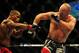 Jul 21, 2012; Calgary, AB, CANADA; Tim Boetsch (blue gloves) and Hector Lombard (red gloves) during the middleweight bout of UFC 149 at the Scotiabank Saddledome. Mandatory Credit: Anne-Marie Sorvin-USA TODAY Sports