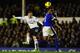 LIVERPOOL, ENGLAND - DECEMBER 09: Everton player Sylvain Distin can only watch as Spurs player Gylfi Sigurdsson gets in a shot at goal during the Barclays Premier game between Everton and Tottenham Hotspur at Goodison Park on December 9, 2012 in Liverpool, England. (Photo by Stu Forster/Getty Images)