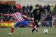 MADRID, SPAIN - FEBRUARY 26: Lionel Messi of Barcelona is challenged by Koke Resurreccion of Atletico Madrid during the La Liga match between Atletico Madrid and Barcelona at Vicente Calderon Stadium on February 26, 2012 in Madrid, Spain. (Photo by Angel Martinez/Getty Images)