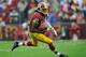 LANDOVER, MD - DECEMBER 09: Robert Griffin III #10 of the Washington Redskins scrambles with the ball against the Baltimore Ravens in the second half during a game at FedExField on December 9, 2012 in Landover, Maryland. (Photo by Patrick McDermott/Getty Images)