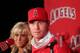 ANAHEIM, CA - DECEMBER 15: Josh Hamilton #32 of the Los Angeles Angels of Anaheim listens to a question from the media as wife Katie looks on during the press conference introducing Hamilton as the team's newest member at ESPN Zone at Downtown Disney on December 15, 2012 in Anaheim, California. (Photo by Victor Decolongon/Getty Images)